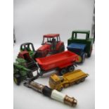 A small selection of play worn toys including a wooden tractor.