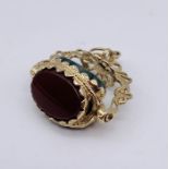 A 9ct gold three sided hardstone swivel fob