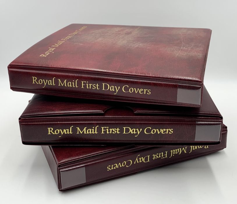 A collection of first day covers in three albums - many with coins, all in excellent condition.