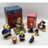 A collection of fire fighting themed figurines including two Disney characters and two Bunnykins