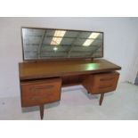 A G-Plan mid-century "Fresco" teak dressing table with rectangular mirror and central hidden