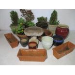 A large collection of glazed and terracotta garden pots, bird bath etc.