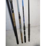 A selection of fishing rods and a telescopic net.