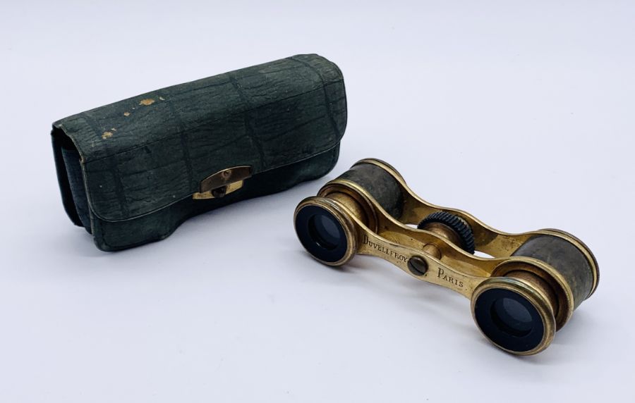 A pair of French opera glasses in leather case, the glasses stamped Duvelleroy, Paris