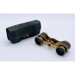 A pair of French opera glasses in leather case, the glasses stamped Duvelleroy, Paris