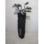 A set of Wilson 1200LT golf irons in Howson carry bag. Irons include 3 to 9 and pitching wedge. Also