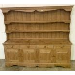 A large pine dresser with four drawers and two cupboards under H194cm W194cm D40cm