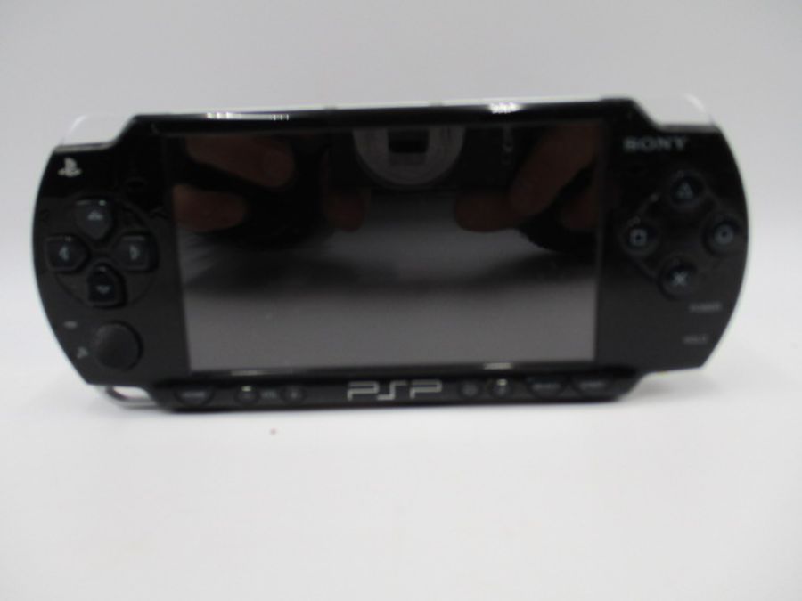 A boxed Sony PSP-2003 Piano Black handheld console with charger, along with four PSP games ( - Image 4 of 10