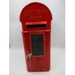 A cast iron Royal Mail letter box/postbox with a dome top and side mount fitments, stamp marked with