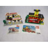 Two sets of vintage Lego including the Shell Service Station (377) and Town Fire Station (374) -