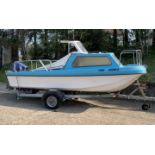 An 18ft 6" Wilson Flyer fishing boat with Suzuki 40 HP outboard on galvanised steel trailer. This