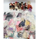 A collection of various dolls clothes including Sindy, Barbie, Pippa etc along with a small