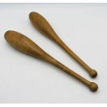 A pair of wooden Indian exercise clubs