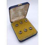 A cased set of Essex crystal buttons each with an image of a hunting hound