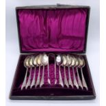 A cased set of hallmarked silver tea spoons with matching sugar nips, 1 spoon missing