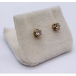 A pair of diamond solitaire earrings each of approx. 0.25ct set in 9ct gold