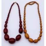 Two vintage amber coloured necklaces