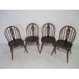 A set of four Ercol Windsor style dining chairs