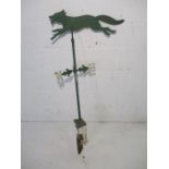 An antique wrought iron weather vane depicting a fox