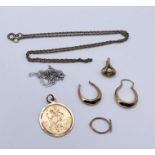 A collection of 9ct gold including a St.Christopher, odd earrings, a pendant and two fine chains,