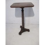 A Victorian occasional table on barley twist column