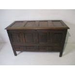 An antique oak mule chest with two drawers under