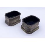 A pair of hallmarked silver octagonal salts with blue glass liners, total silver weight 167g