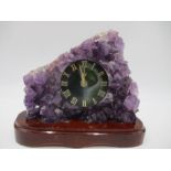 An amethyst crystal geode with inset clock with agate face, height 20cm