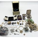 A collection of costume jewellery including a 925 silver bracelet