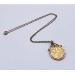 A Victorian half sovereign dated 1888 mounted in a 9ct gold frame with 9ct chain, total weight 11g