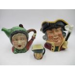 A Royal Doulton "Town Crier" character jug along with a mini character jug and a Beswick tea pot "