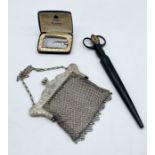 An SCM mesh work purse along with a Ronson Varaflame lighter and a pair of steel Solingen scissors