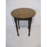 A Victorian rustic pub table on turned legs