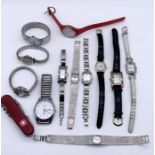 A collection of watches along with a Swiss Army style penknife