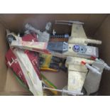 A collection of Star Wars toys merchandise from the 1990s including an X Wing fighter, a Jedi