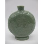 A Chinese Celadon moon flask with embossed dragon, height 15cm