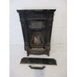 A Victorian cast iron fire surround.