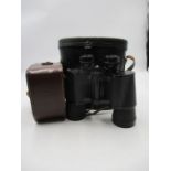 A vintage Eumig cine camera plus a set of Vista 10x50 binoculars, both in original carry cases.