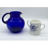 A Bristol blue glass jug along with a Coalport commemorative loving cup for the General Election
