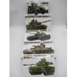 A collection of four boxed Tamiya military miniatures ready to a assemble precision model tank