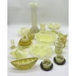 A collection of uranium and vaseline cut glass including vases, jugs, bowls, muffin dish etc some