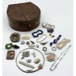 A small collection of costume jewellery in a leather collar box