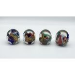 Four paperweights by Pascal Guyot - all signed and dated