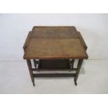 A vintage oak metamorphic tea trolley with presentation label, dated 1939