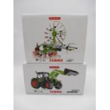 A boxed Wiking Claas Arion 650 tractor with front loader die-cast model (No 0773 25), along with a