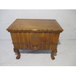 A carved sewing box with single drawer to front