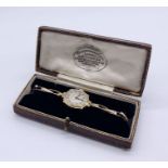 A 9ct gold Tavannes ladies wristwatch on a marked 9ct gold strap, total weight 15.3g