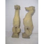 A pair of reconstituted stone greyhounds.