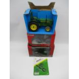 A collection of three die-cast model tractors including a Massey Ferguson 7499 Black limited edition