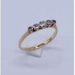 An 18ct gold and platinum five stone diamond ring